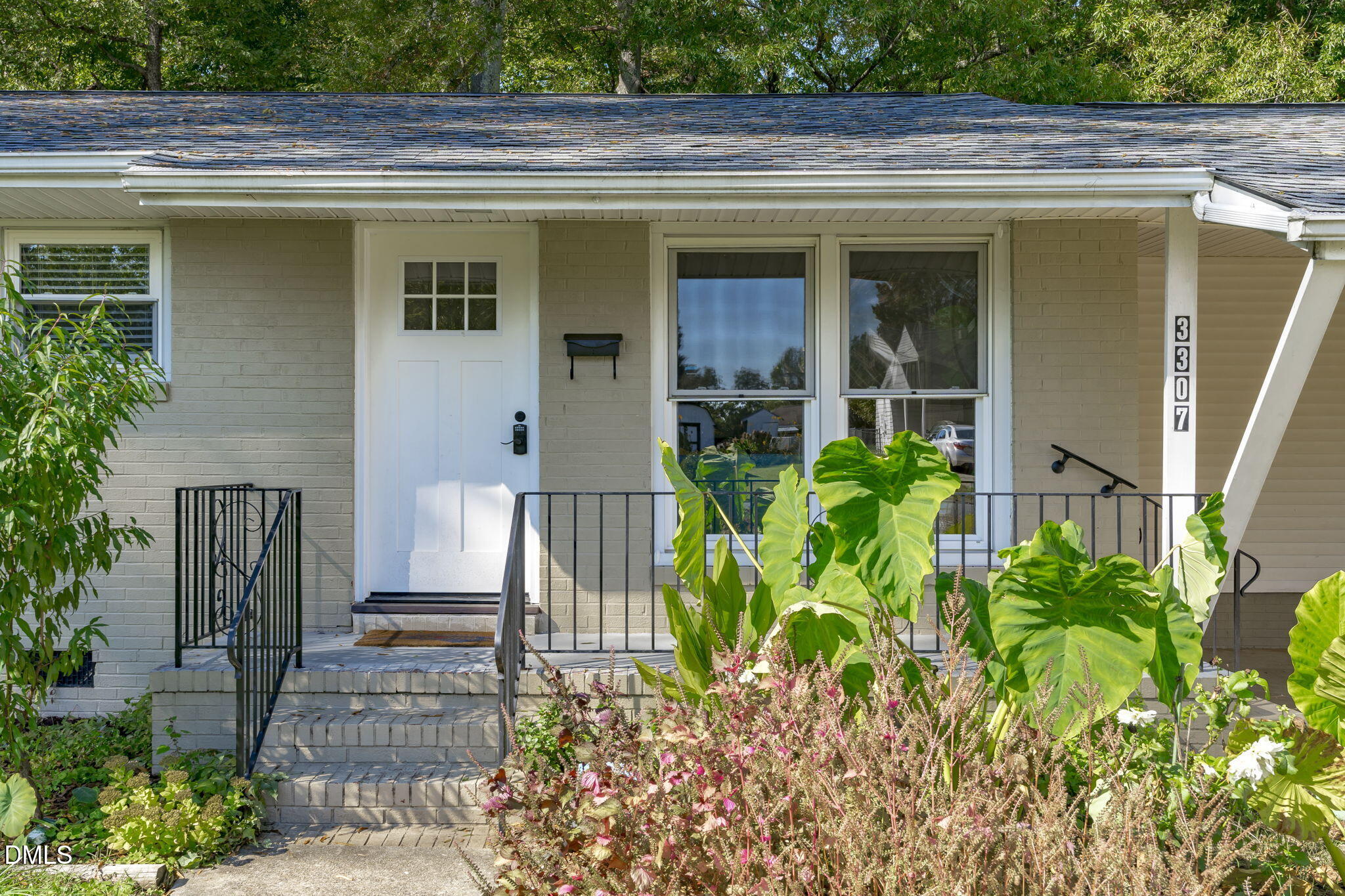 3307 Winston Road Durham, NC 27704 - Photo 2 of 22 a front view of a house with plants
