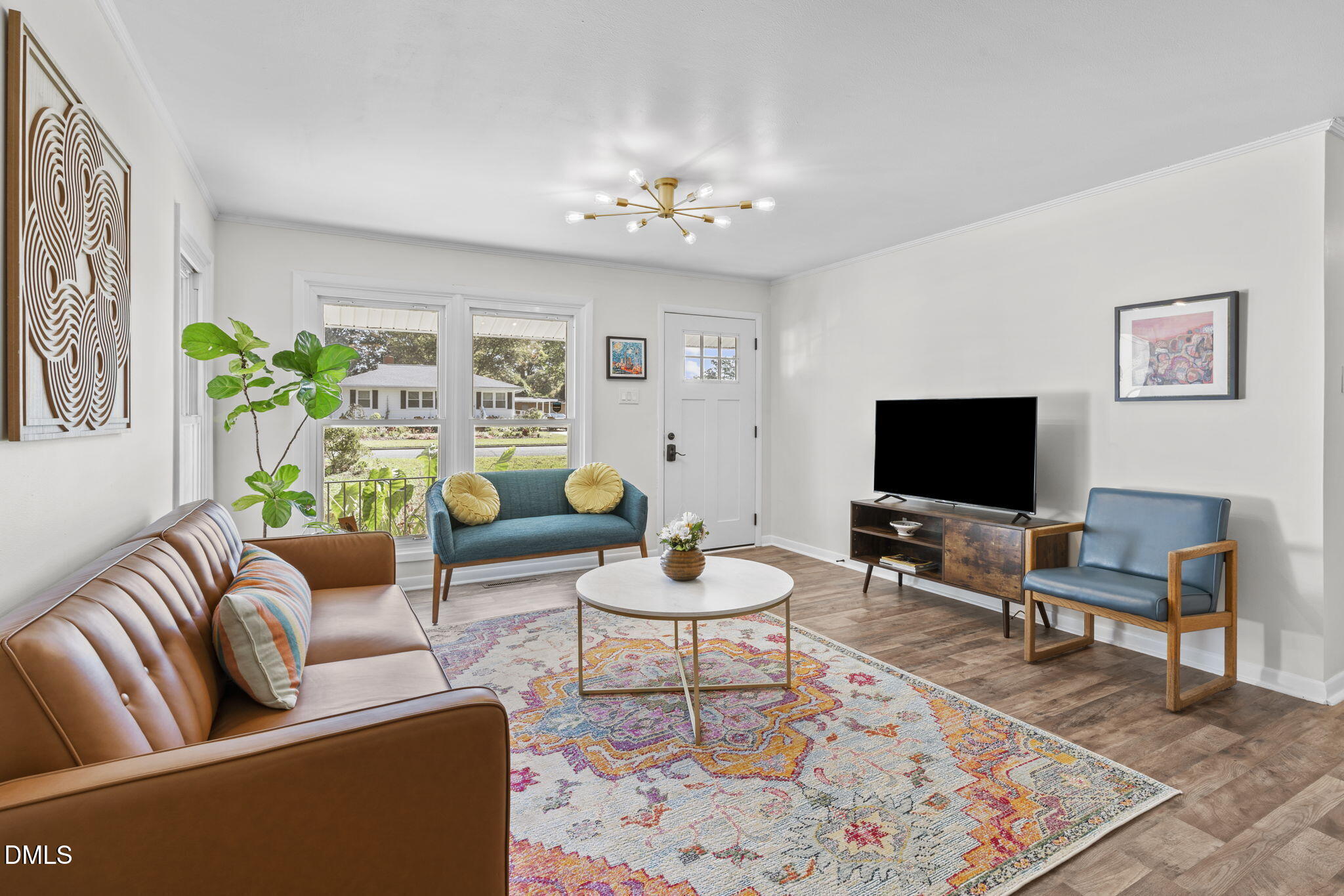 3307 Winston Road Durham, NC 27704 - Photo 7 of 22 a living room with furniture and a flat screen tv