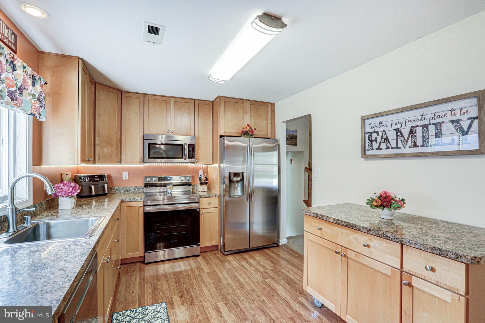 6 3 Rivers Drive Newark, DE 19702 - Photo 27 of 63 Modern kitchen with warm wood tones.