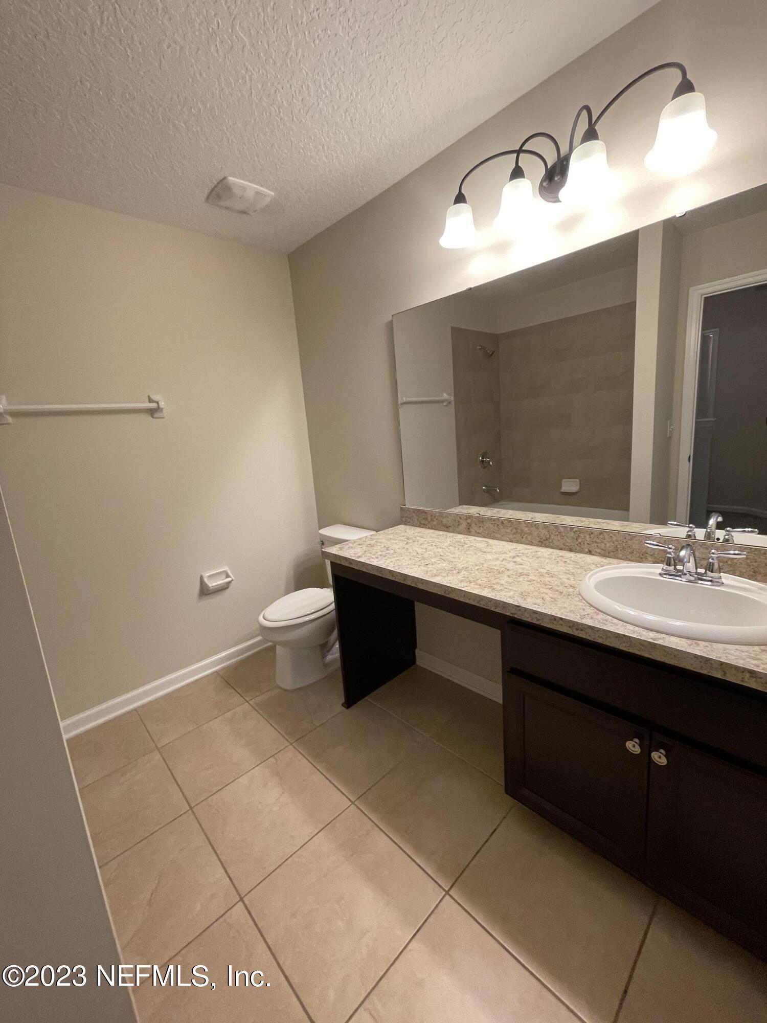 41 Nelson Lane St. Johns, FL 32259 - Photo 13 of 18 a bathroom with a sink and a mirror