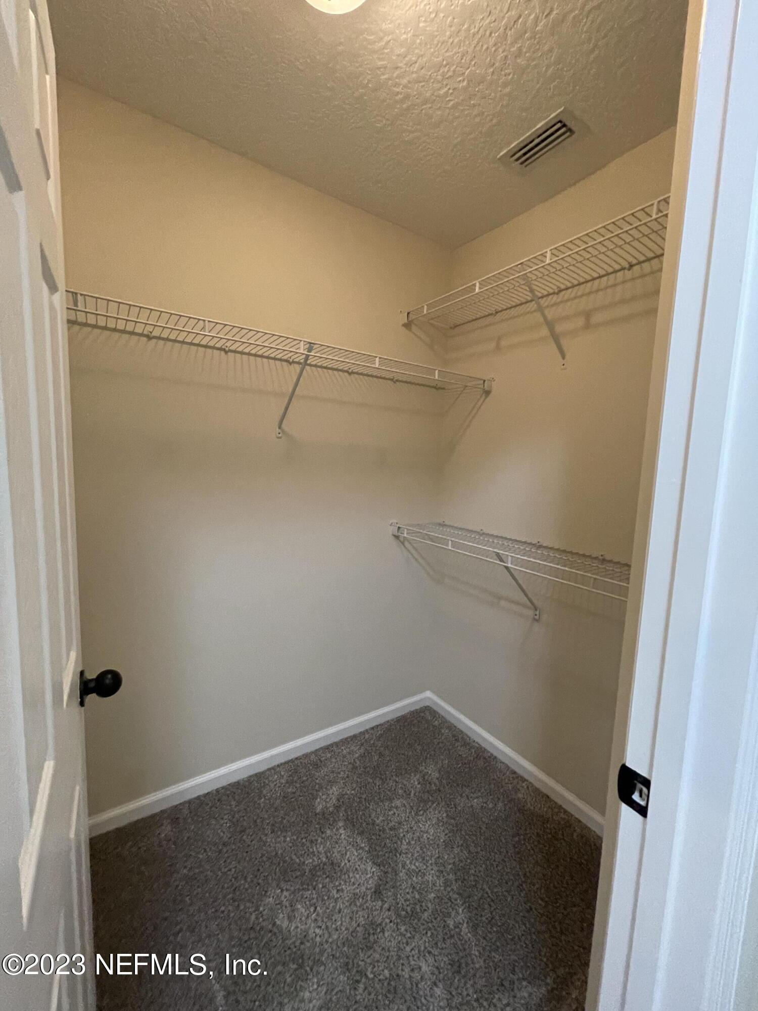 41 Nelson Lane St. Johns, FL 32259 - Photo 15 of 18 a view of a room with racks on the wall