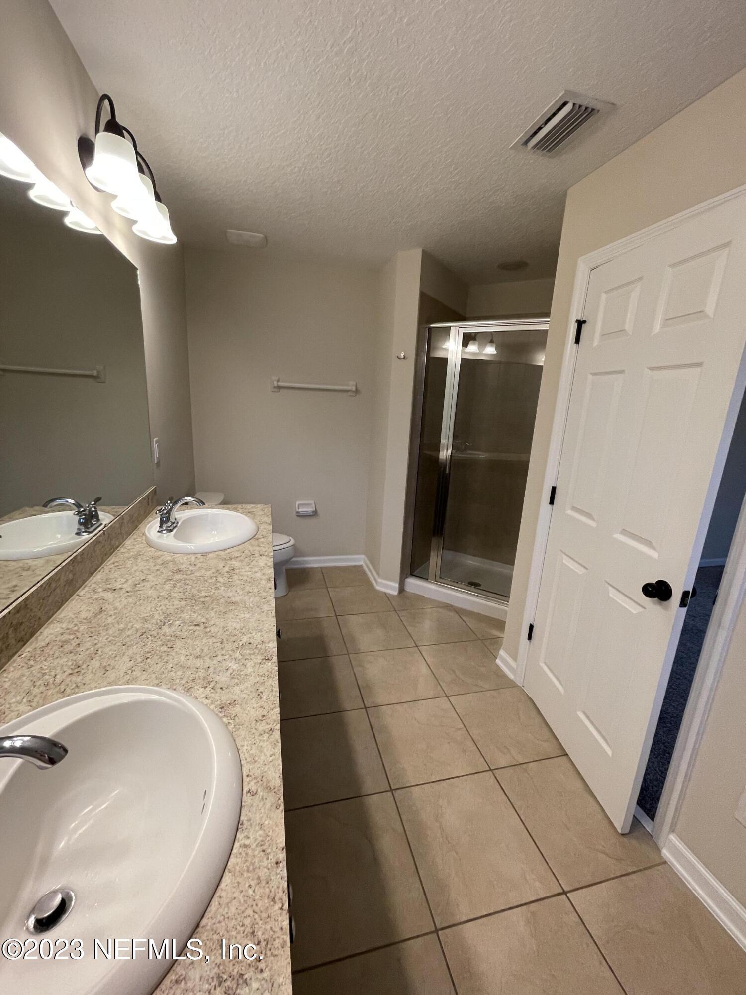 41 Nelson Lane St. Johns, FL 32259 - Photo 16 of 18 a bathroom with a sink and mirror