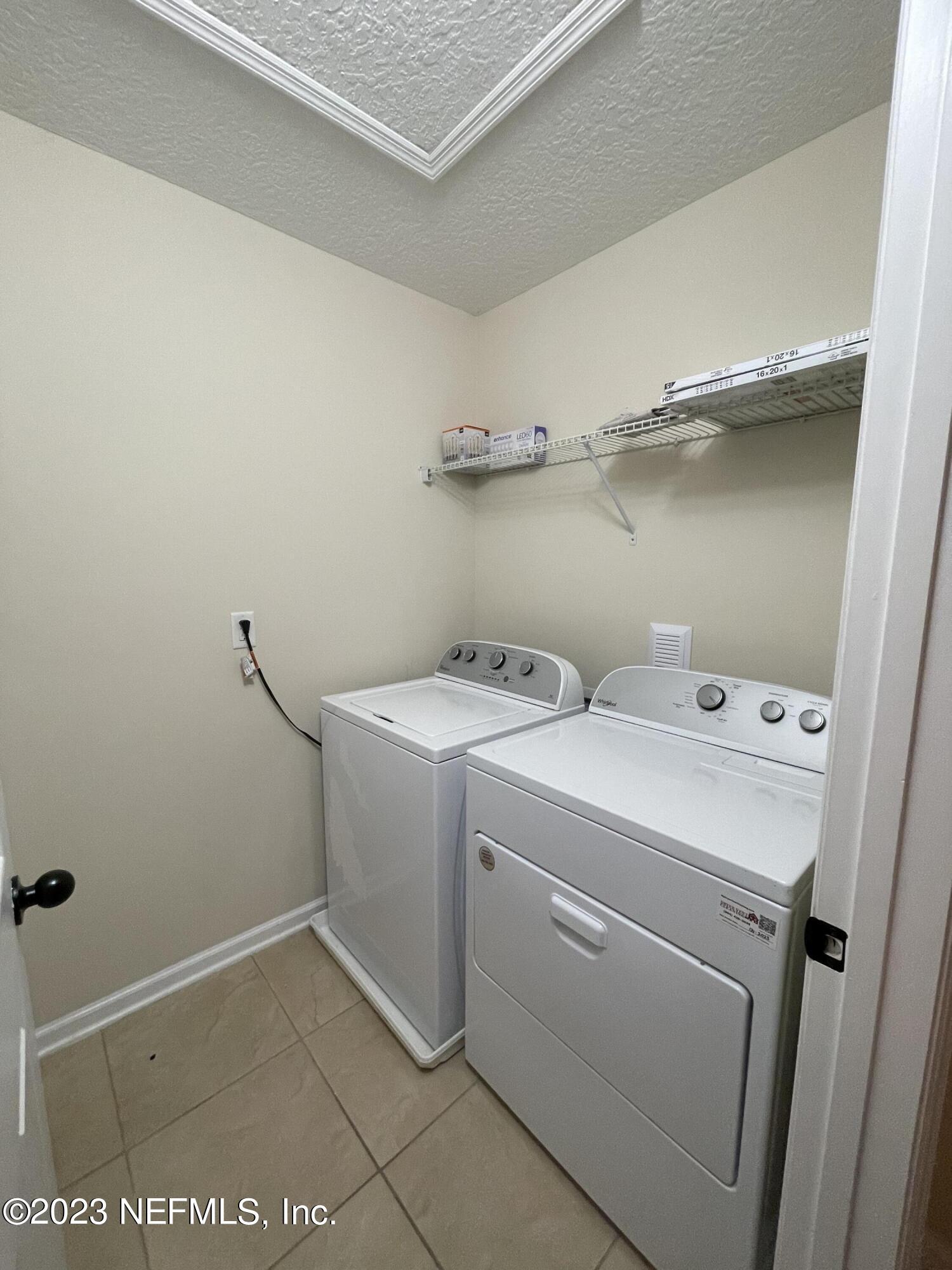 41 Nelson Lane St. Johns, FL 32259 - Photo 9 of 18 a utility room with dryer and washer