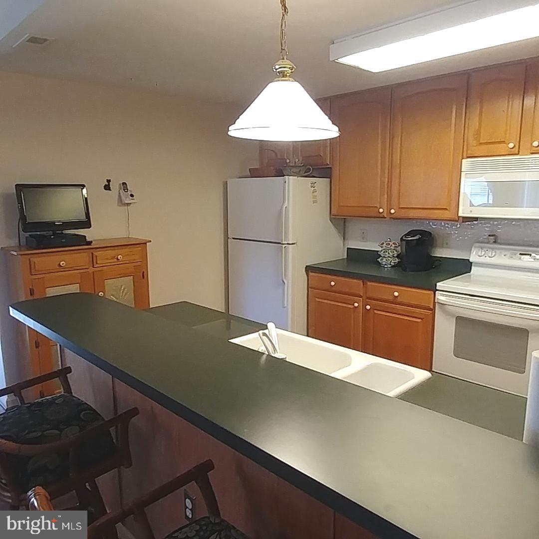 306 Willrich Circle, Unit L Forest Hill, MD 21050 - Photo 8 of 43 Kitchen with Breakfast Bar