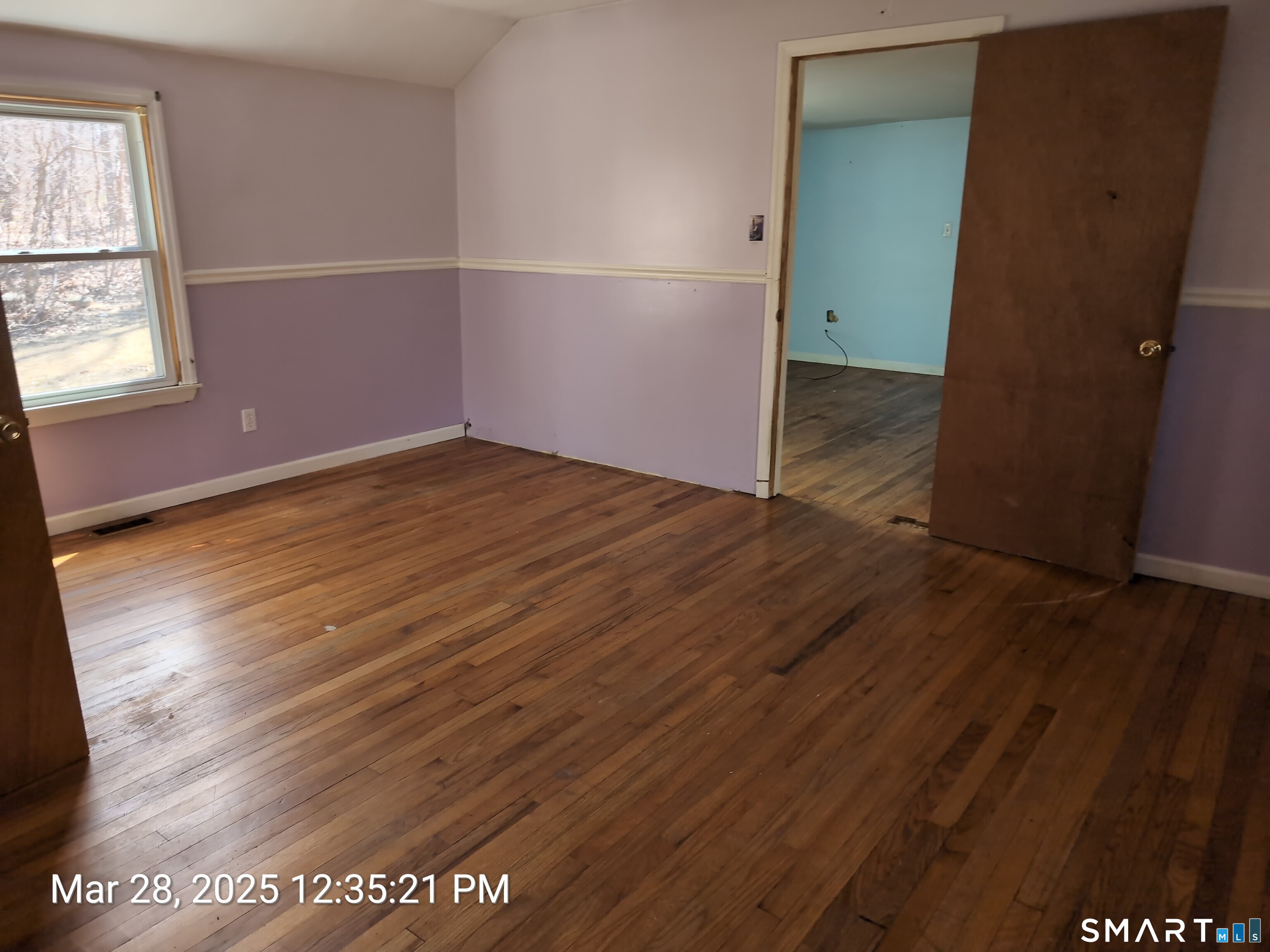 97 Bushy Hill Road Deep River, CT 06417 - Photo 25 of 28 an empty room with wooden floor and windows