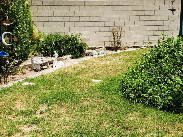 a view of a backyard with sitting area