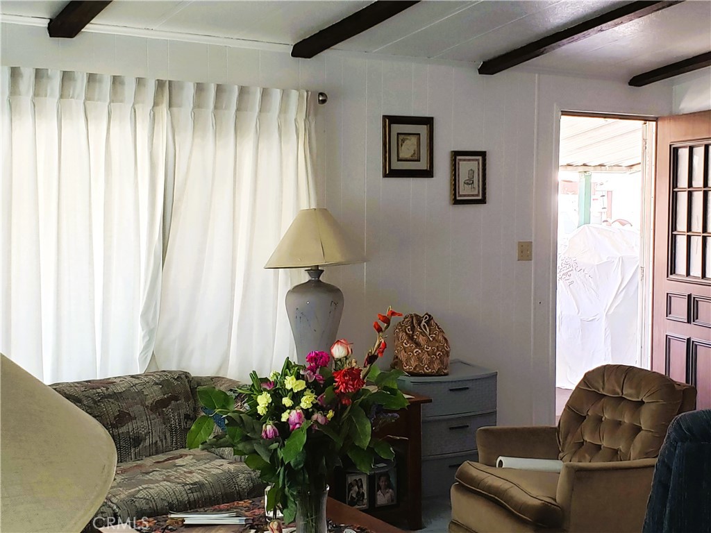 21217 Washington Avenue, Unit 32 Walnut, CA 91789 - Photo 3 of 15 a living room with furniture and a potted plant