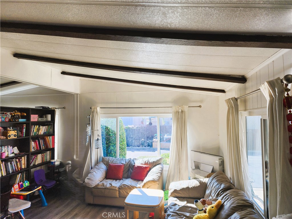 21217 Washington Avenue, Unit 32 Walnut, CA 91789 - Photo 4 of 15 a living room with furniture and a large window