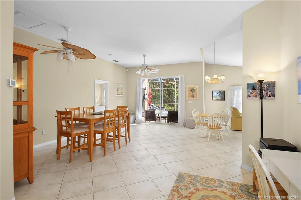 486 Northwest Sunflower Place Stuart, FL 34994 - Photo 7 of 42 a view of a dining area with furniture