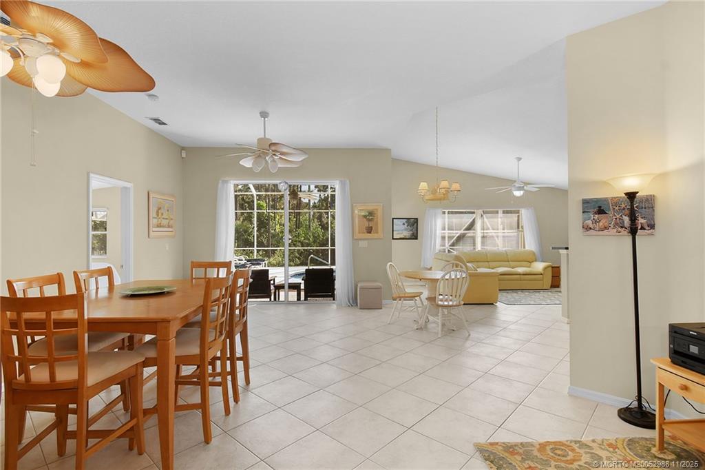 486 Northwest Sunflower Place Stuart, FL 34994 - Photo 8 of 42 a view of a dining room with furniture window and outside view