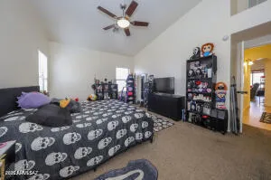 a bedroom with a bed and a chandelier