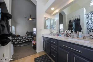 a bathroom with a sink mirror and vanity