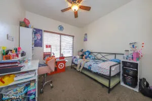 a bedroom with bed and a window