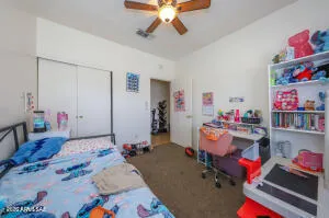 a bed room with a bed and a chandelier