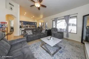 a living room with furniture and a large window