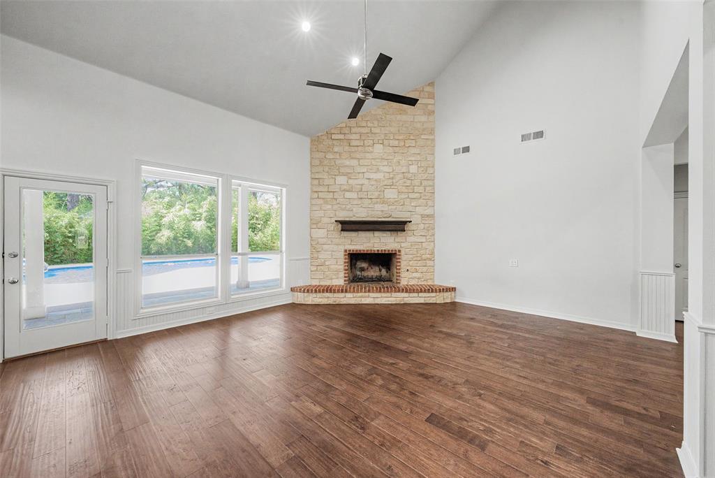 1200 Mount Gilead Road Keller, TX 76262 - Photo 15 of 38 a view of empty room with wooden floor and fireplace