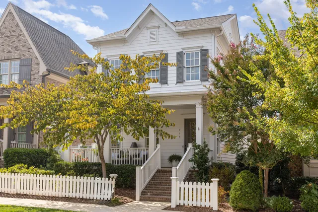 front view of a house with a garden