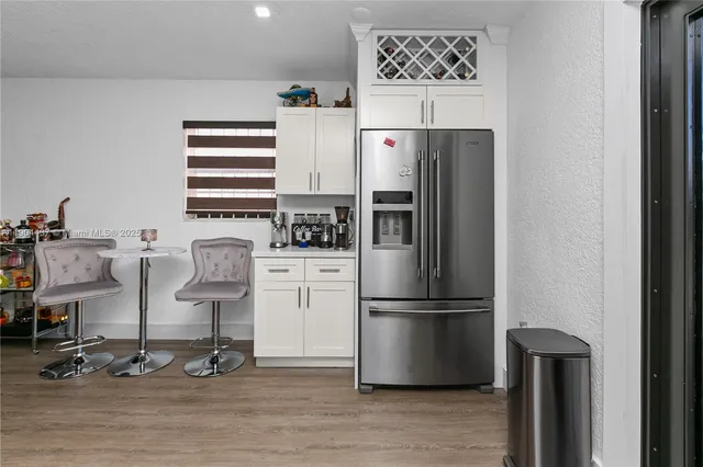 a kitchen with appliances and cabinets