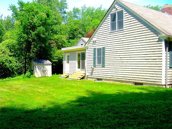 162 Nourse Road Bolton, MA 01740 - Photo 29 of 30 a view of a house with a backyard