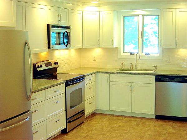 162 Nourse Road Bolton, MA 01740 - Photo 3 of 30 a kitchen with sink cabinets and window