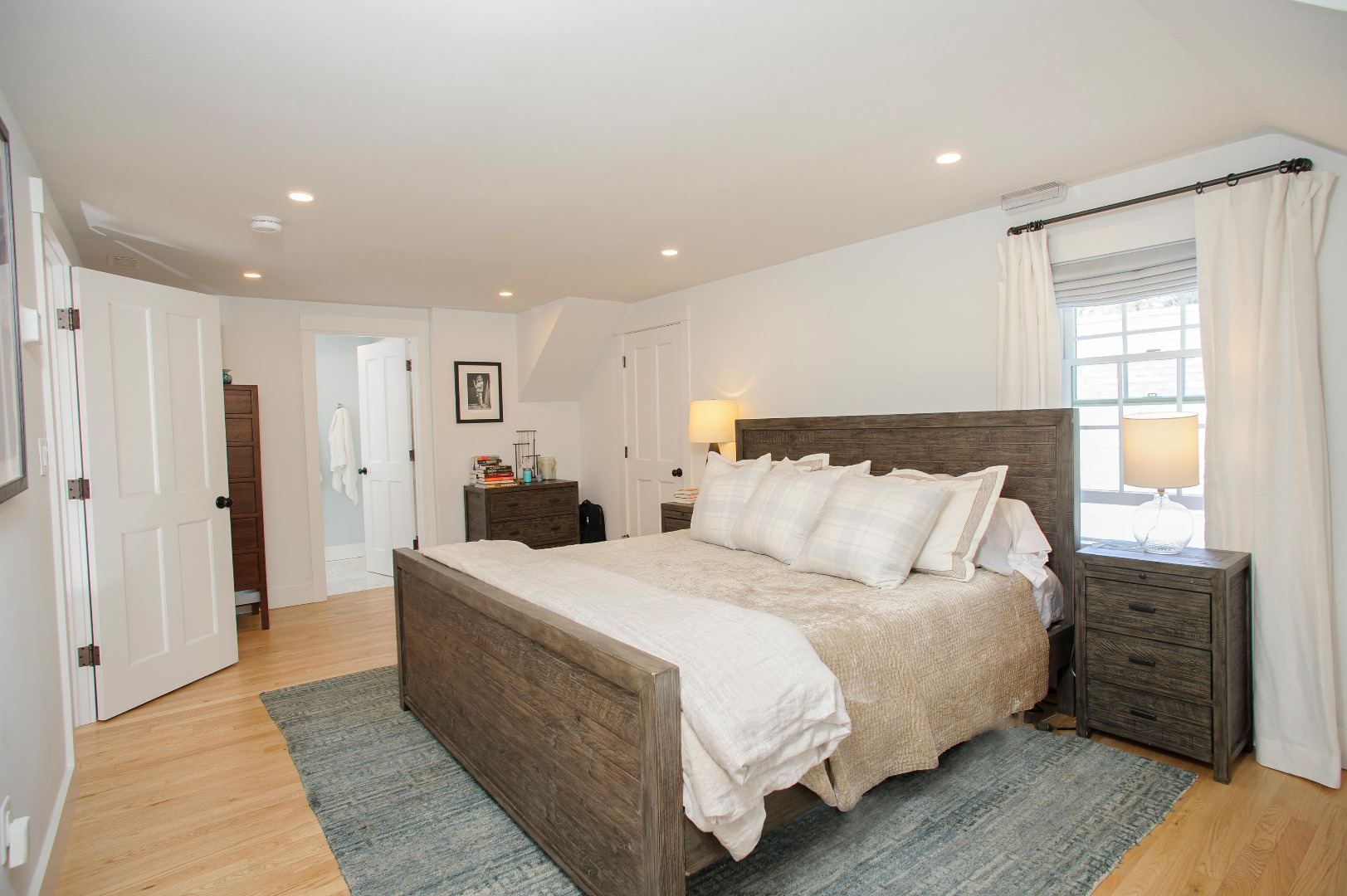 31 North Street Edgartown, MA 02539 - Photo 40 of 49 a large bedroom with a bed and wooden floor