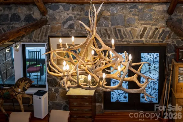 a roof deck with couch and chairs