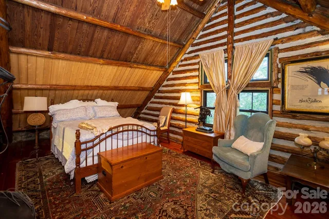 a bedroom with furniture and a window