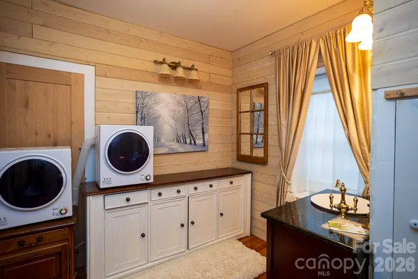a view of a bathroom with a sink and a window