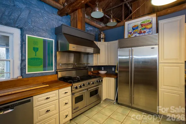 a kitchen with a stove and a sink