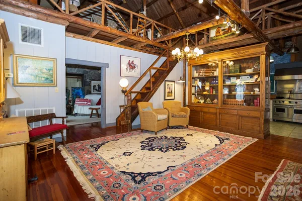 a view of a kitchen with a table and chairs