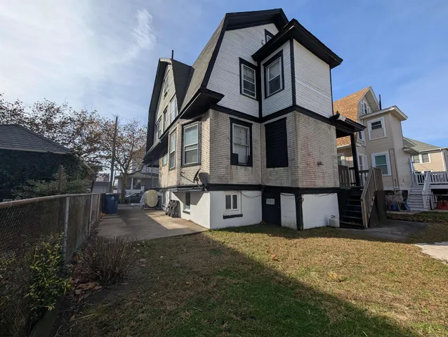 a aerial view of a house with a backyard