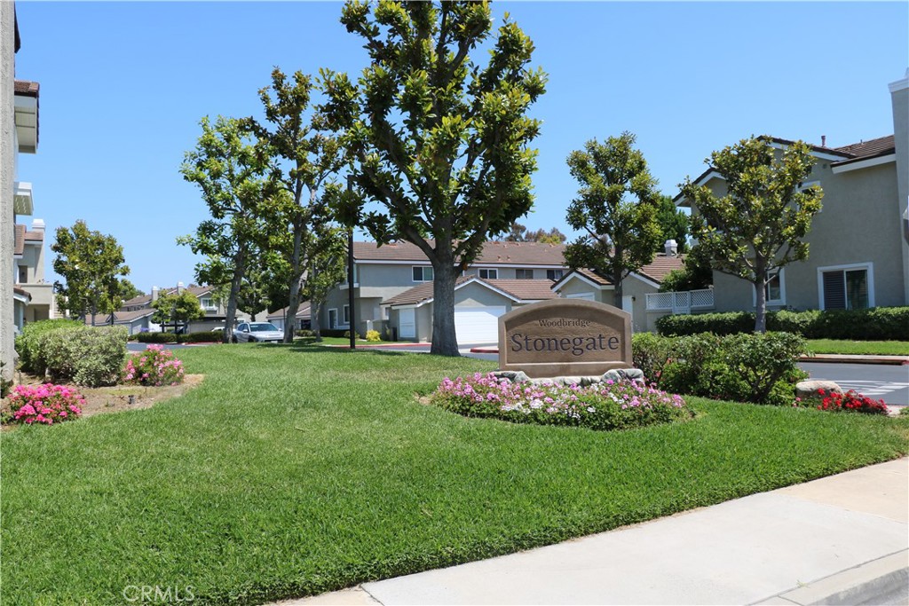 80 Greenmoor, Unit 40 Irvine, CA 92614 - Photo 26 of 26 a front view of a house with a garden