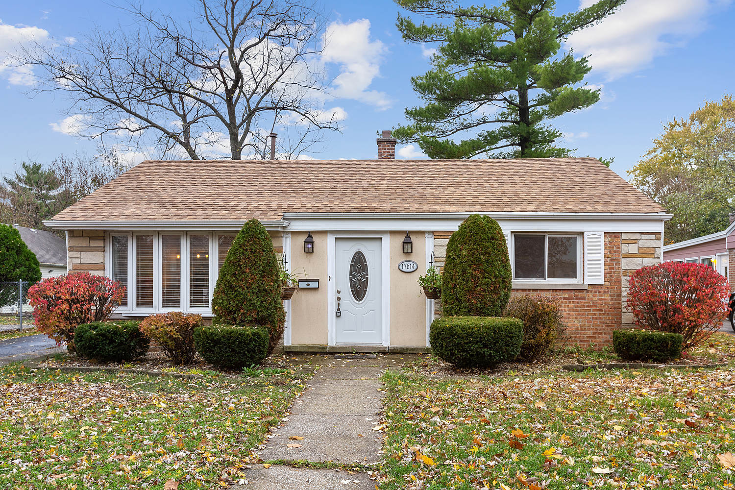 17614 Howe Avenue Homewood, IL 60430 - Photo 1 of 11 a front view of a house with garden