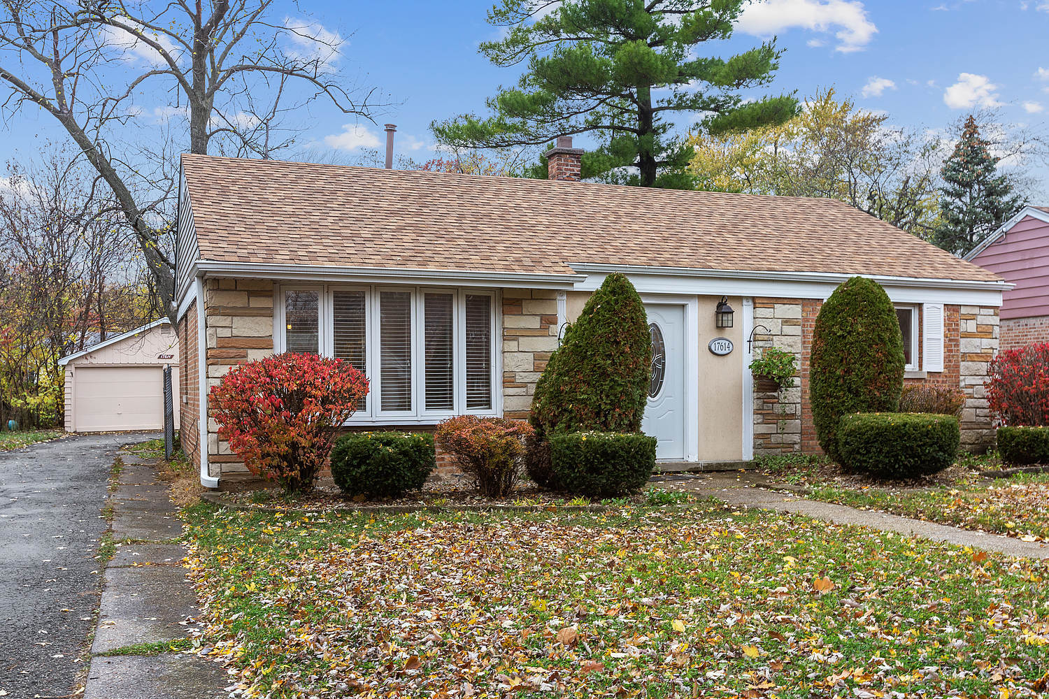17614 Howe Avenue Homewood, IL 60430 - Photo 2 of 11 a front view of a house with garden