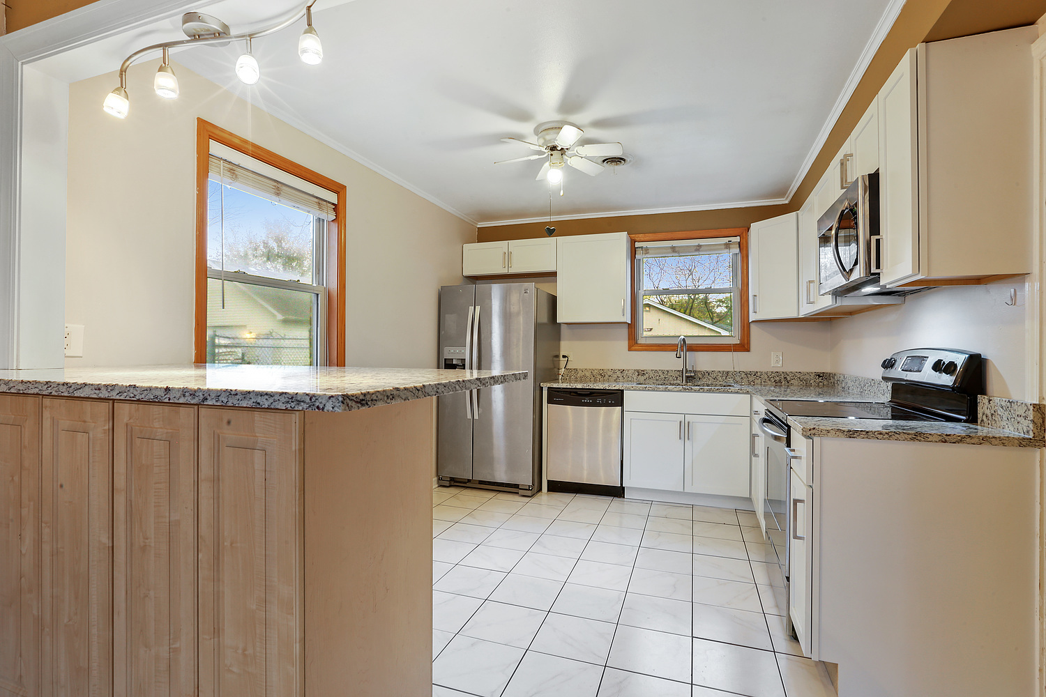 17614 Howe Avenue Homewood, IL 60430 - Photo 5 of 11 a kitchen with granite countertop a sink appliances cabinets and counter space