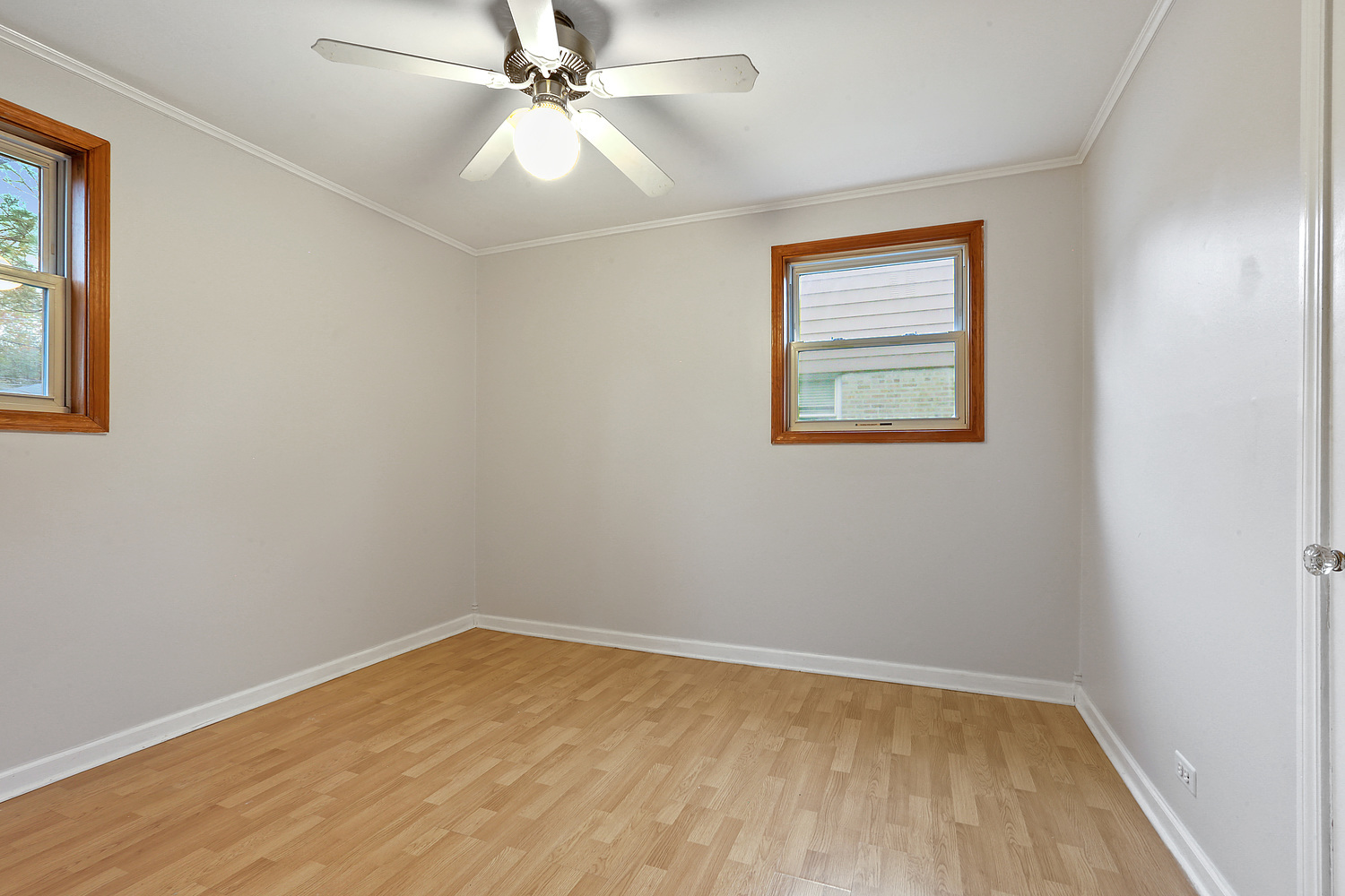 17614 Howe Avenue Homewood, IL 60430 - Photo 7 of 11 wooden floor in an empty room with a window