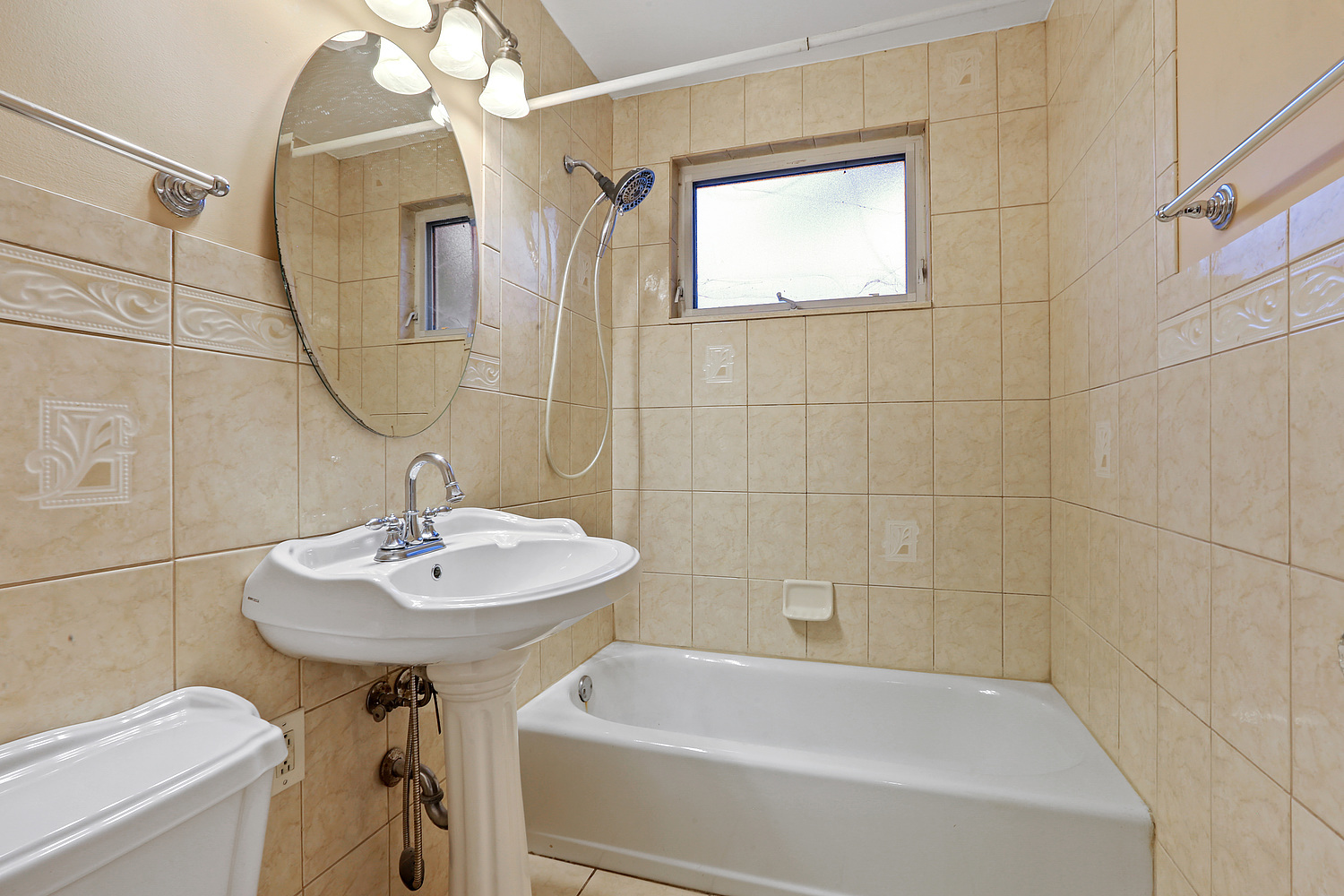 17614 Howe Avenue Homewood, IL 60430 - Photo 8 of 11 a bathroom with a sink a toilet and bathtub