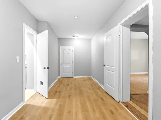 a bedroom with a bed and a mirror