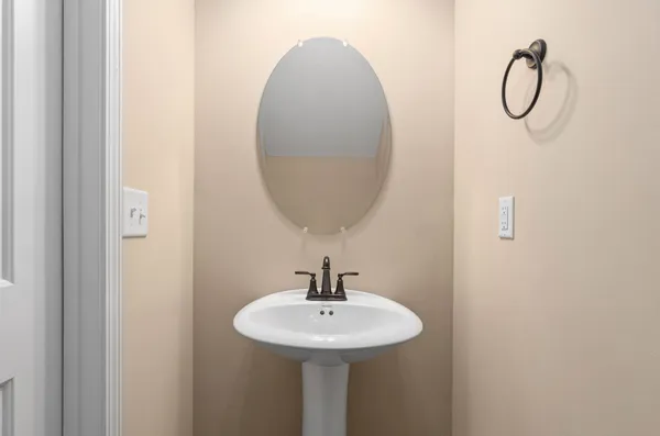 a bathroom with a sink and mirror