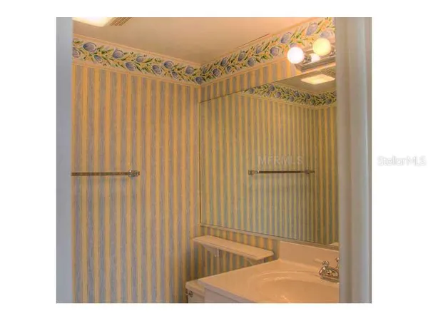 a bathroom with a shower curtain