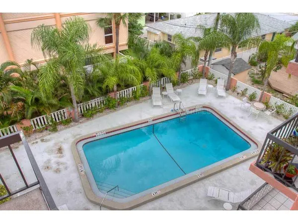 a view of a swimming pool with a patio