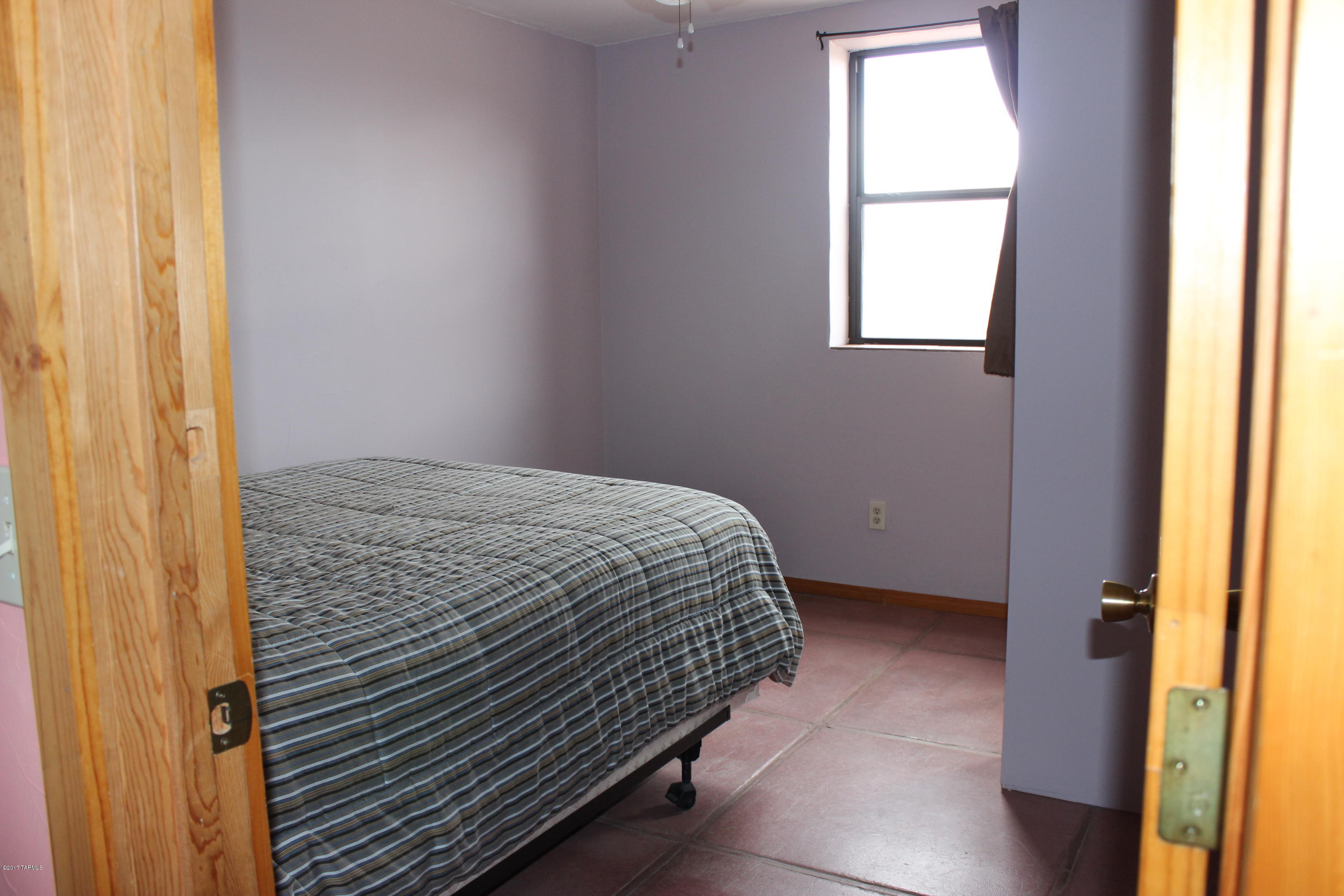 3609 East Compadre Road Willcox, AZ 85643 - Photo 16 of 19 a bedroom with a bed and a window