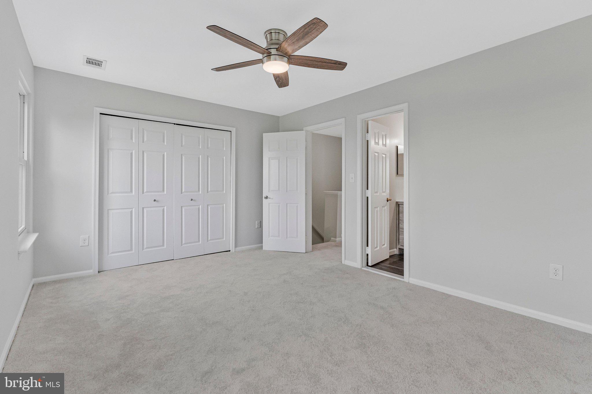 20718 Apollo Terrace Ashburn, VA 20147 - Photo 17 of 50 an empty room with closet and fan
