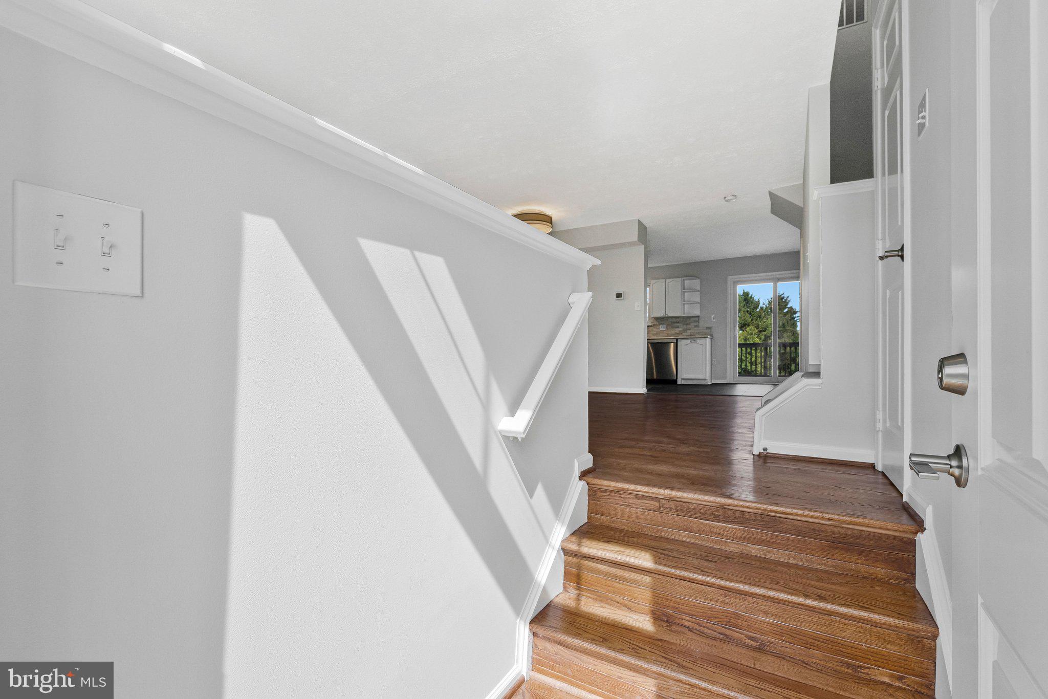 20718 Apollo Terrace Ashburn, VA 20147 - Photo 2 of 50 a view of entryway and hall with wooden floor