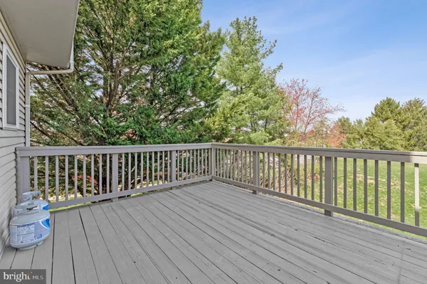 a view of a house with garden and deck
