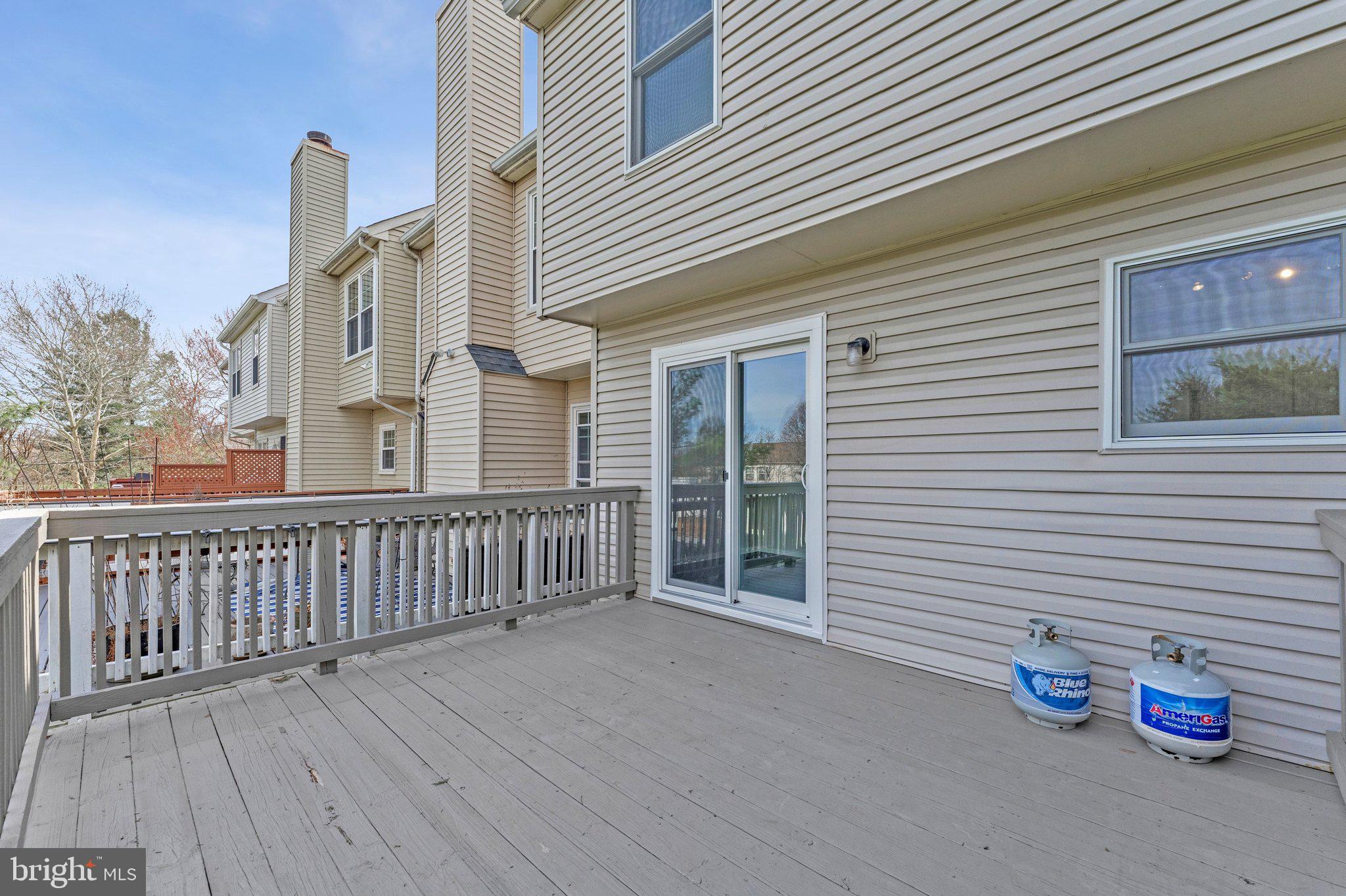 20718 Apollo Terrace Ashburn, VA 20147 - Photo 37 of 50 a view of a house with a wooden deck