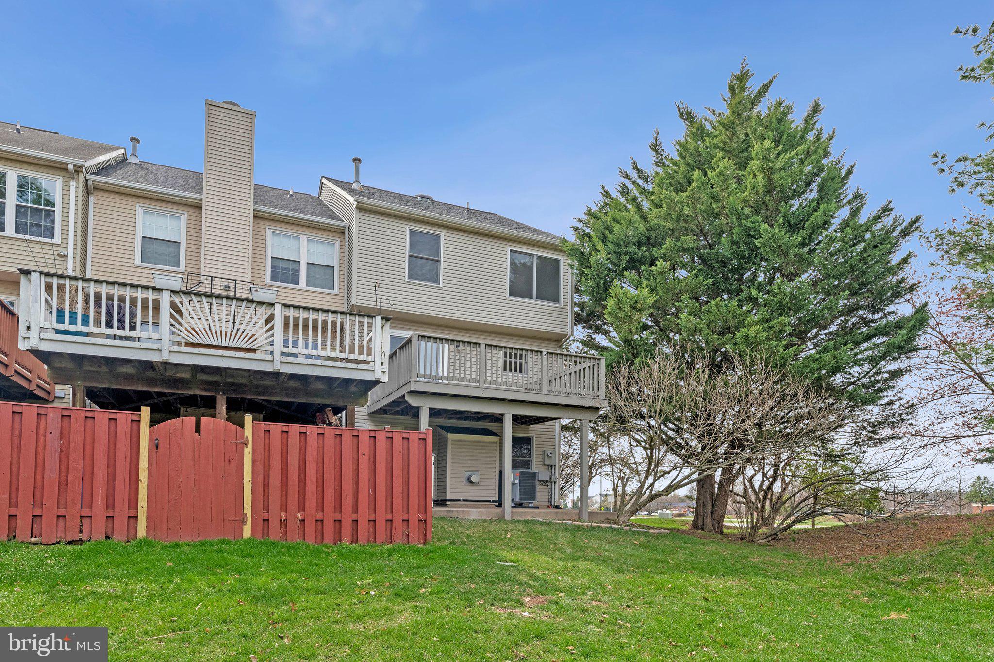 20718 Apollo Terrace Ashburn, VA 20147 - Photo 40 of 50 a view of a house with garden and deck