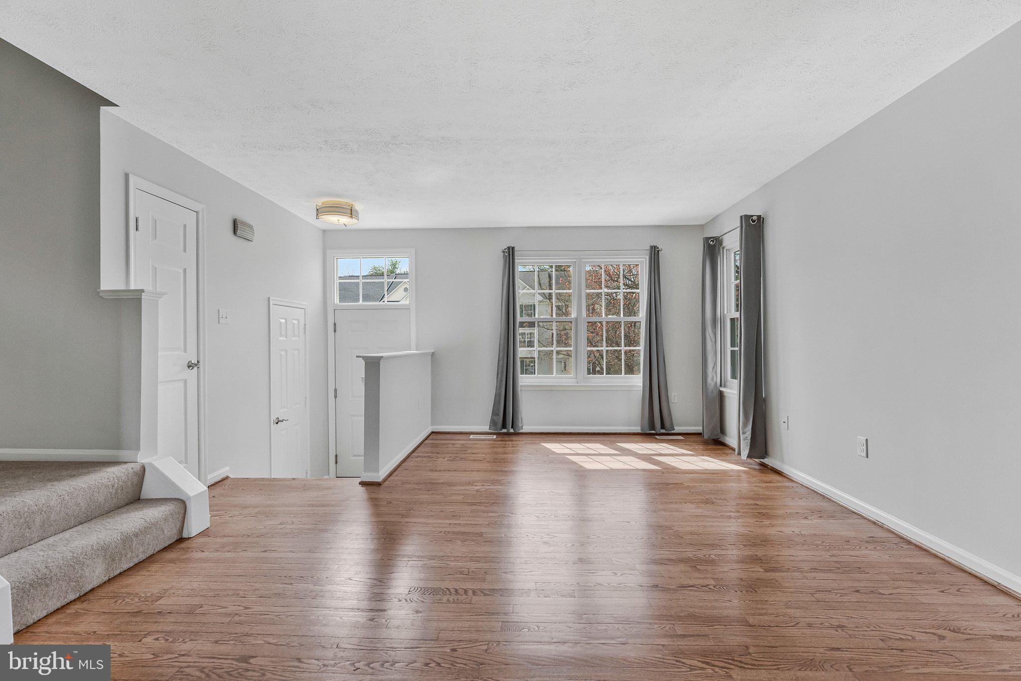 20718 Apollo Terrace Ashburn, VA 20147 - Photo 6 of 50 a view of an empty room with furniture and a window