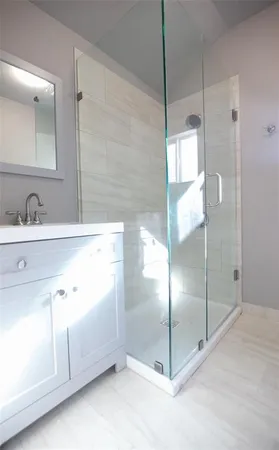 a bathroom with a double vanity sink mirror and double