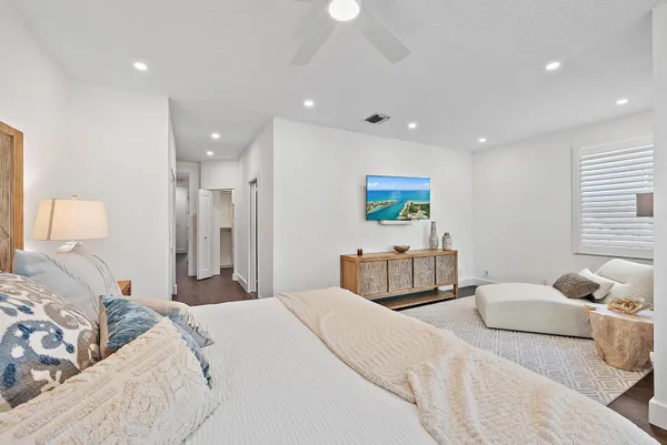 a bedroom with a bed and a lamp